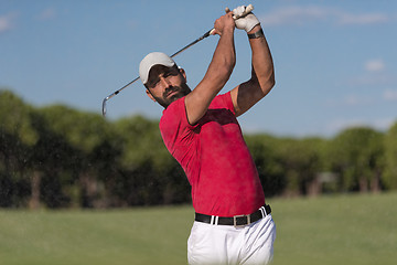 Image showing golfer hitting a sand bunker shot