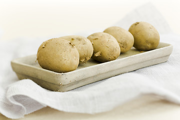 Image showing Five raw potatoes