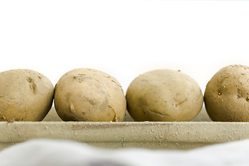 Image showing Five raw potatoes