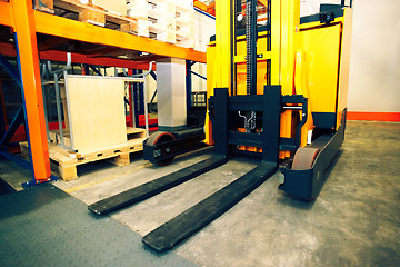 Image showing Shelves, racks and forklift  with pallets in distribution wareho