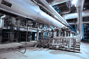 Image showing Equipment, cables and piping as found inside of a modern industr