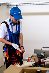 Image showing Young electrician performs task of competition