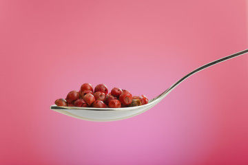 Image showing spoon filled with rose peppers