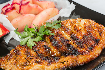 Image showing plate of grilled meat with fries