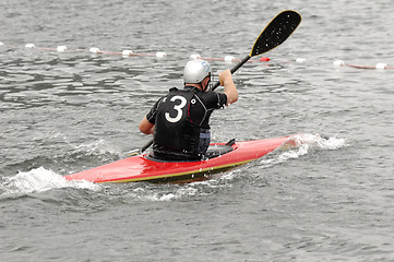 Image showing Man paddling in his kayak