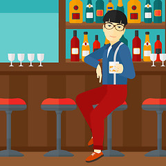 Image showing Man sitting at bar.