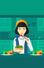 Image showing Woman eating salad.