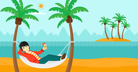 Image showing Man chilling in hammock.