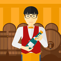 Image showing Waiter holding bottle of wine.