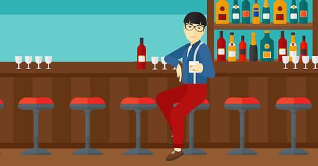 Image showing Man sitting at bar.