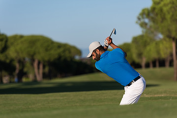 Image showing pro golfer hitting a sand bunker shot