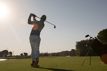 Image showing golf player hitting shot