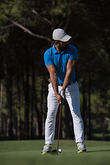 Image showing golf player hitting shot