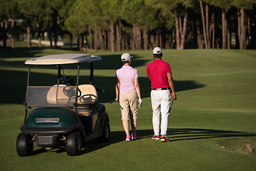 Image showing couple walking on golf course