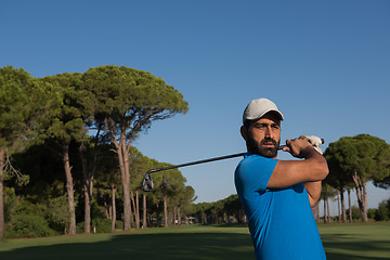 Image showing golf player hitting shot