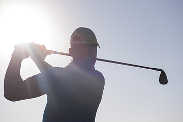 Image showing golf player hitting shot