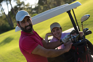 Image showing couple in buggy on golf course