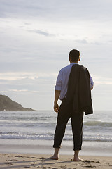 Image showing Businessman barefoot on beach