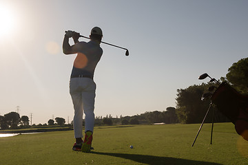 Image showing golf player hitting shot