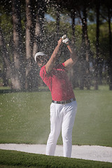 Image showing golfer hitting a sand bunker shot