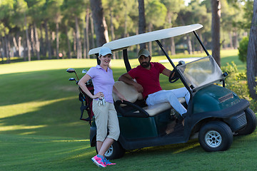 Image showing couple in buggy on golf course