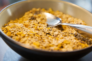 Image showing close up of bowl with granola or muesli and spoon