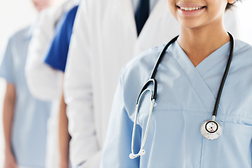 Image showing close up of happy doctor or nurse with stethoscope