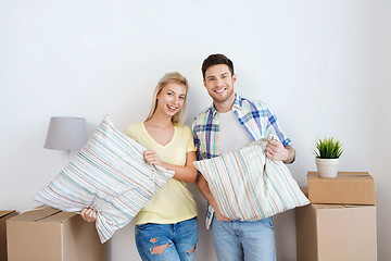 Image showing happy couple with stuff moving to new home