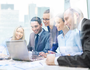 Image showing business team with laptop having discussion