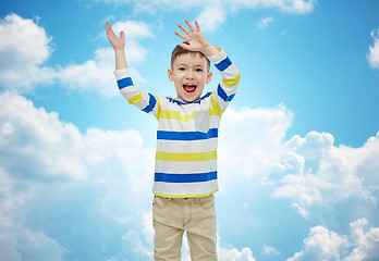 Image showing happy little boy waving hands