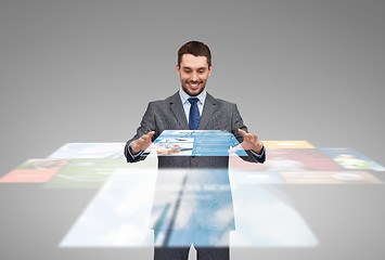 Image showing businessman working with news projection