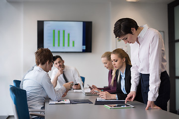 Image showing young  woman using  tablet on business meeting