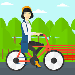 Image showing Woman riding bicycle.