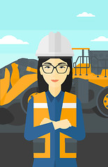 Image showing Miner with mining equipment on background.