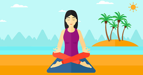 Image showing Woman meditating in lotus pose.