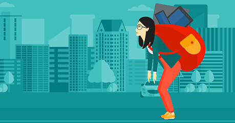 Image showing Woman with backpack full of devices.