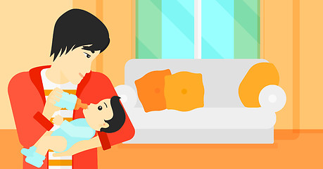 Image showing Man feeding baby.