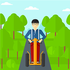 Image showing Man riding on electric scooter.