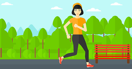 Image showing Sportive woman jogging.