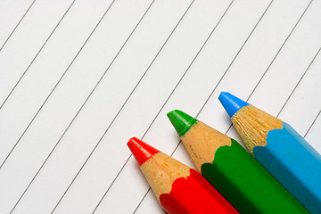 Image showing Color pencils on a notepad

