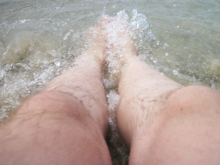 Image showing man legs in the sea water