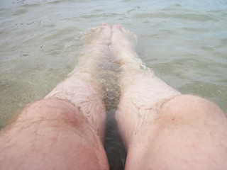 Image showing man legs in the sea water