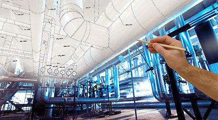 Image showing man\'s hand draws a design of factory combined with photo of mode