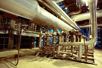 Image showing Equipment, cables and piping as found inside of a modern industr