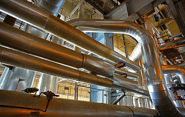 Image showing Equipment, cables and piping as found inside of a modern industr