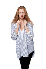 Image showing Female fashion model posing in plaid striped shirt