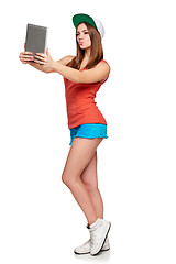 Image showing Full length sporty female with digital tablet