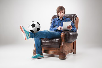 Image showing Portrait of young man with laptop and football ball