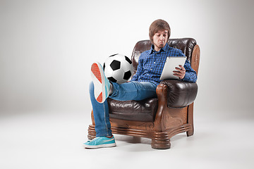 Image showing Portrait of young man with laptop and football ball