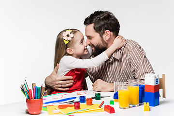 Image showing The daughter and father drawing together